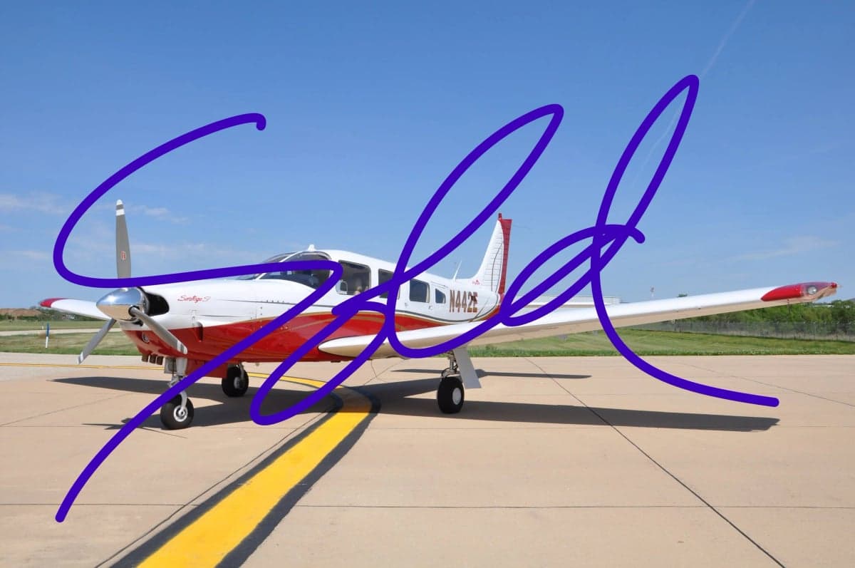 Piper Saratoga with red and white paint scheme on the tarmac with SOLD overlay.