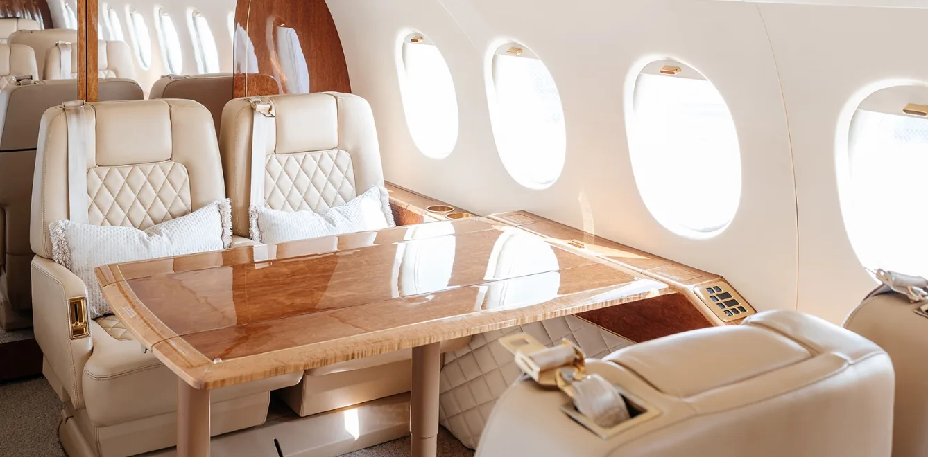 A view of the aircraft's interior, showing the seating arrangement and table.
