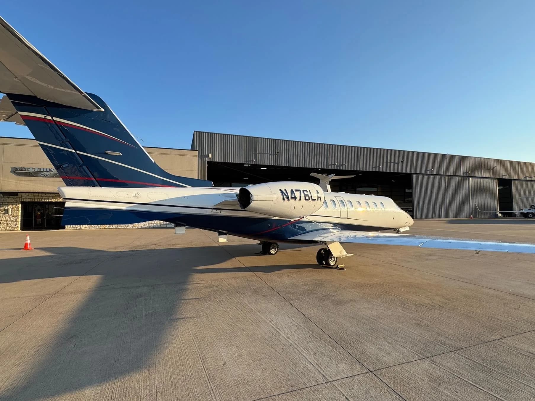 Side view of the N476LA aircraft on the ground.