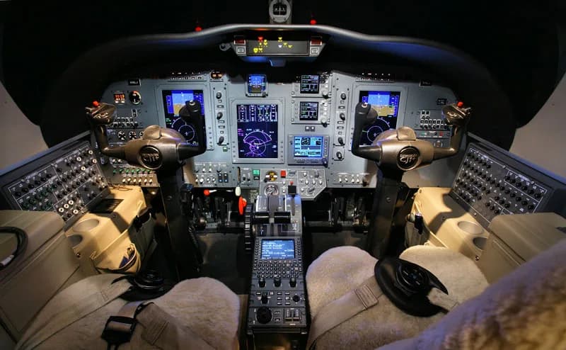 Detailed view of the aircraft's cockpit instrument panel and controls.