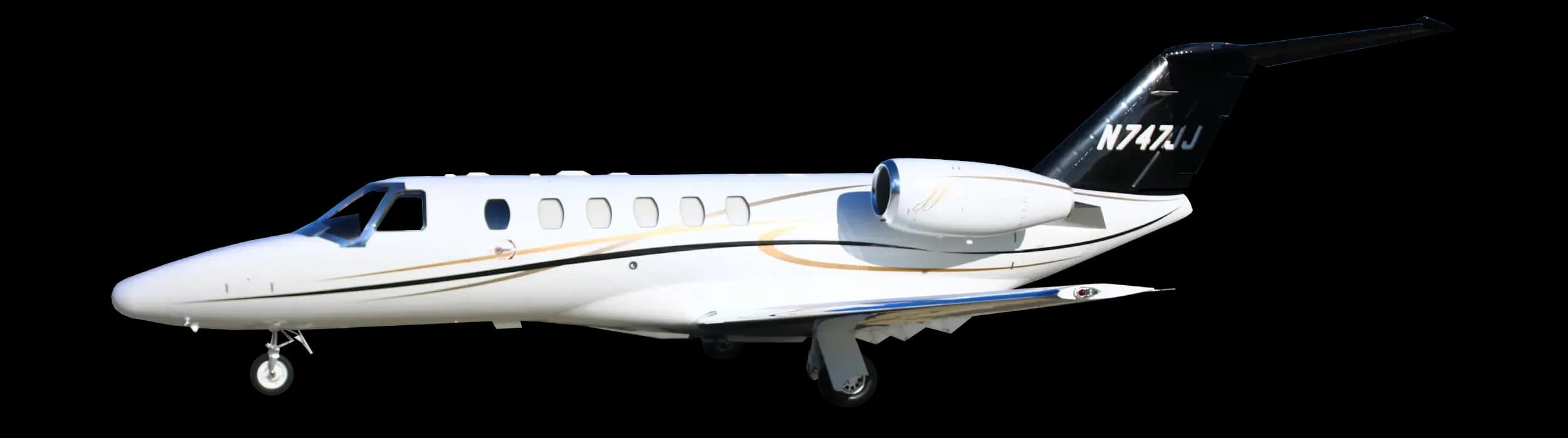 A white business jet with a black tail and gold and black accent stripes, showing the N-number N747JJ, against a white background.