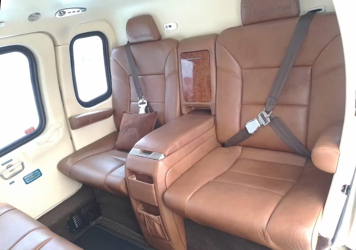 Interior view of the helicopter cabin with leather seats.