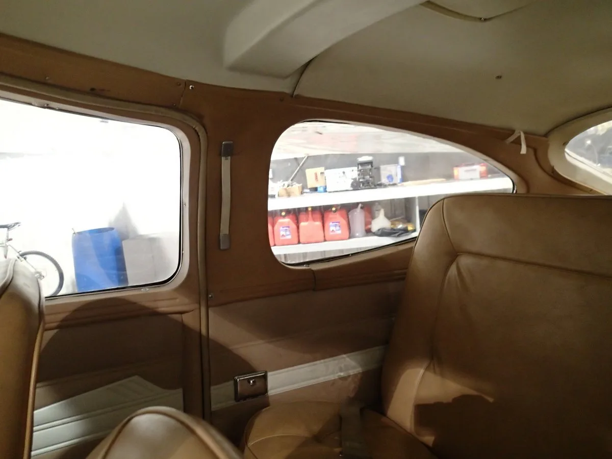 Interior view of the Cessna 177 Cardinal cabin, showing the side window and seat.