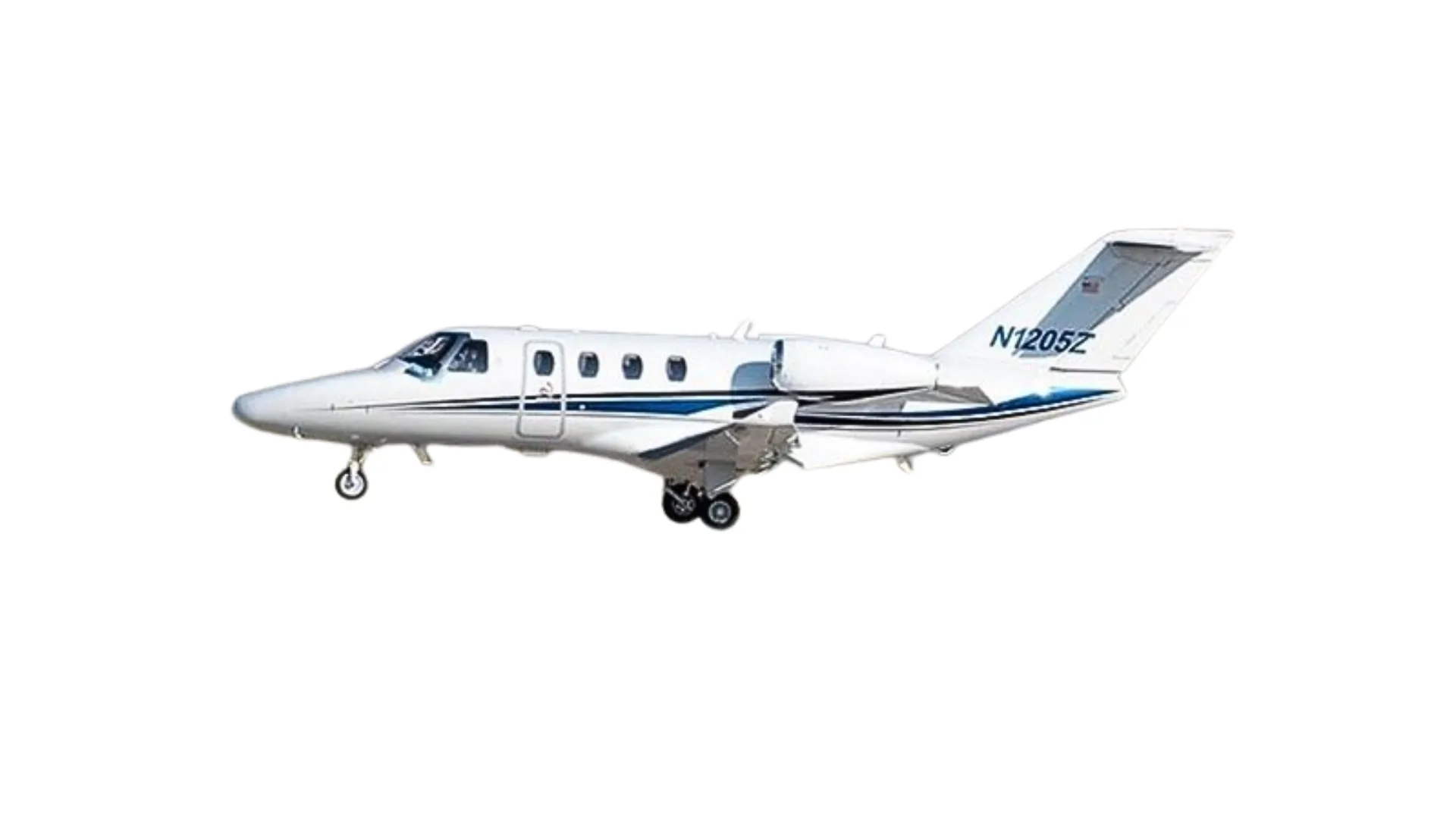 A white Cessna Citation business jet with blue stripes and registration N1205Z, viewed from the side.