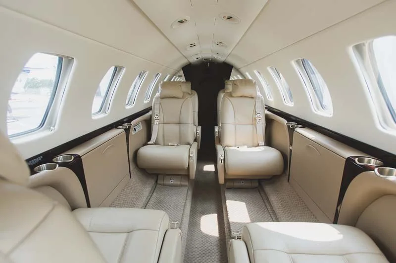 Forward view of the aircraft's interior with leather seats.