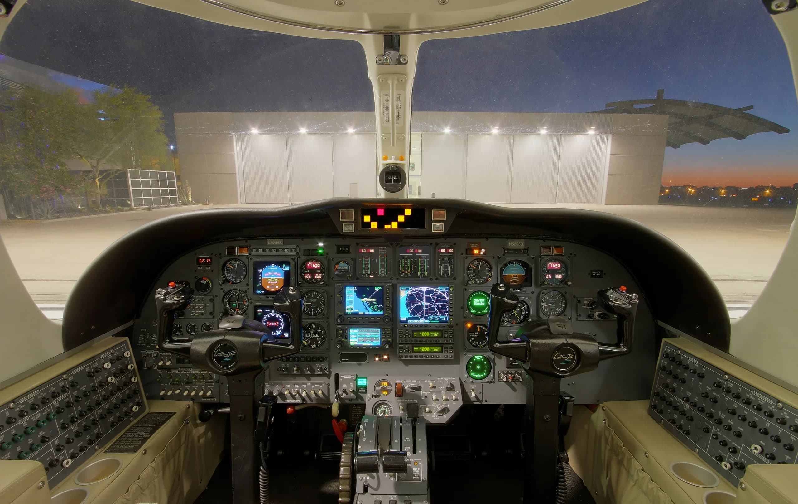 The cockpit of a Cessna Citation CJ3 features a full instrument panel and controls.