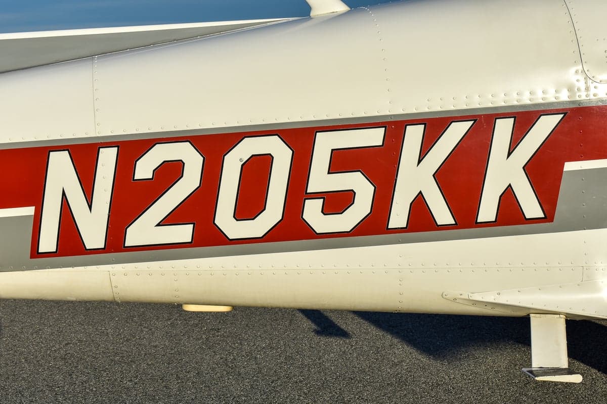 Rear view of the N205KK aircraft on the tarmac.