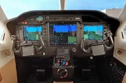 Aircraft cockpit with a modern glass panel display.
