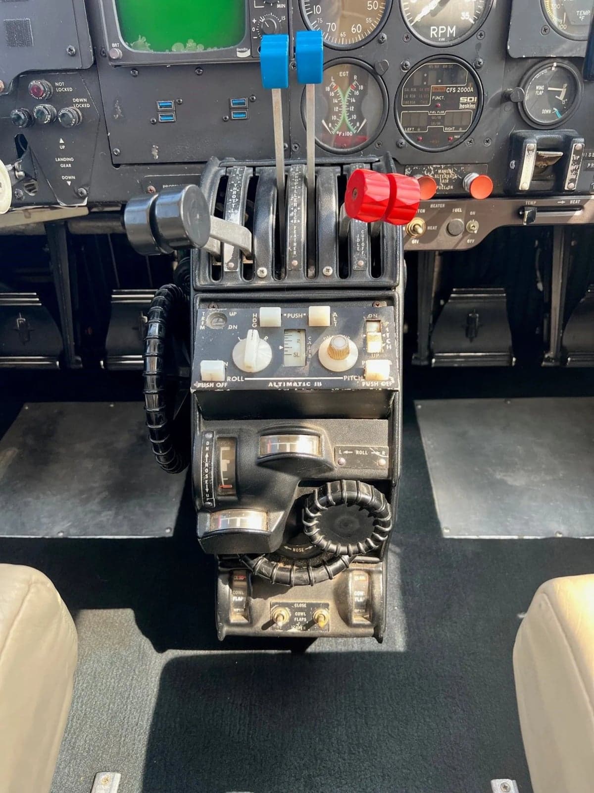 View of the aircraft's cockpit with a full instrument panel.