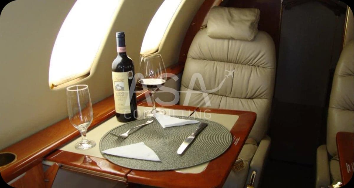 A table set for a meal inside the aircraft cabin.