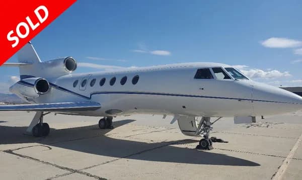 Falcon 2000 with SOLD overlay.