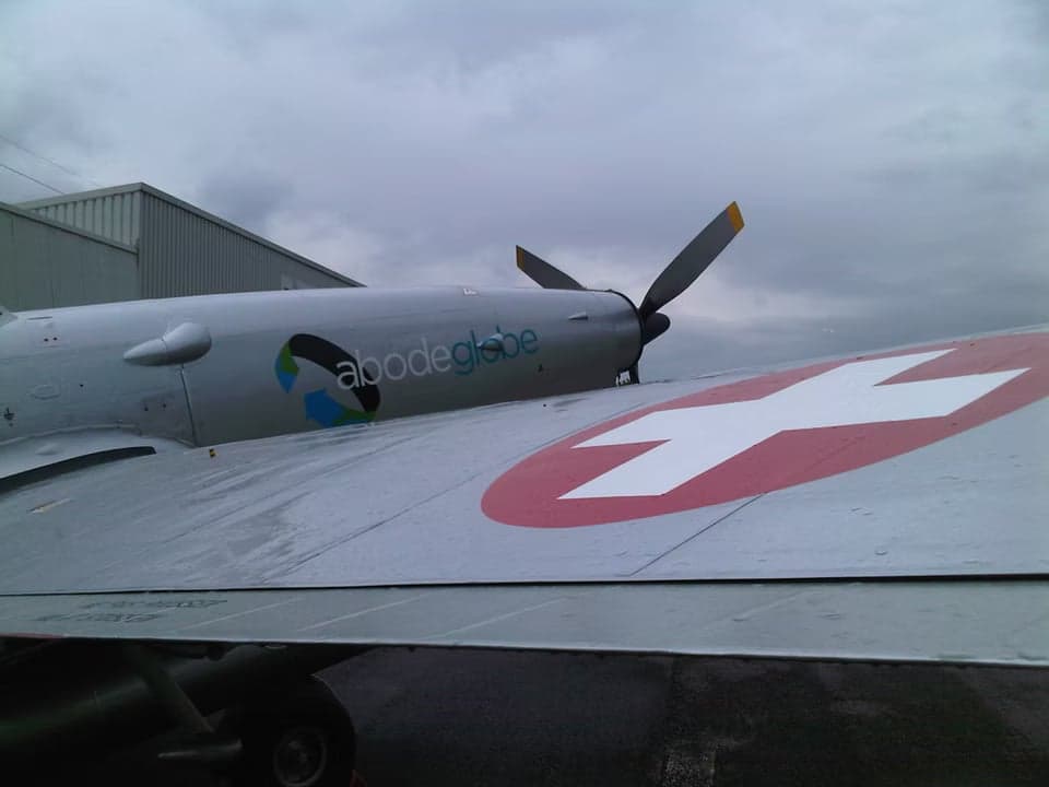 P-3 Pilatus with Abode Globe logo on the fuselage.