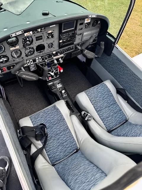 View of the aircraft's cockpit and front seats.