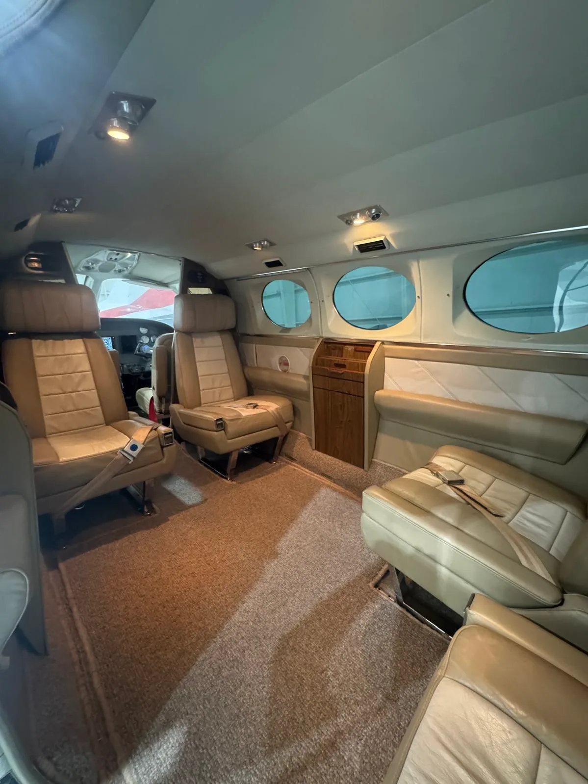 The interior of a Cessna 421 Golden Eagle with tan leather seats.