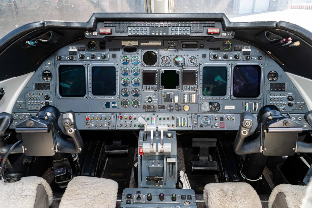 The instrument panel and controls in the cockpit of the aircraft.