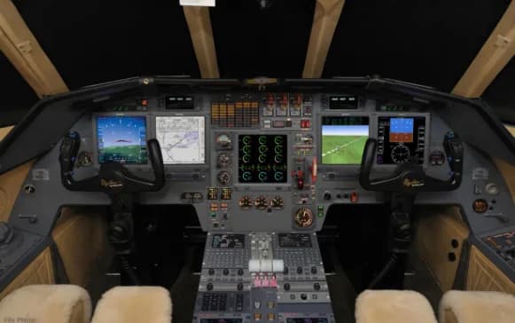 View of the instrument panel in the cockpit of an aircraft.