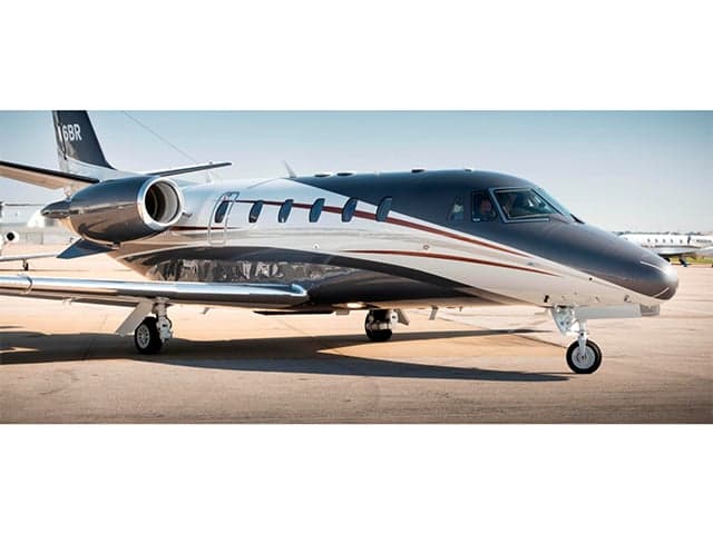 Stock photo of a business jet on the tarmac.
