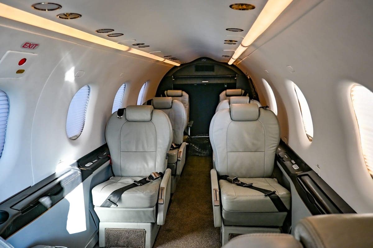 Interior view of the Pilatus PC-12 cabin, showing the seating arrangement and cabin layout.