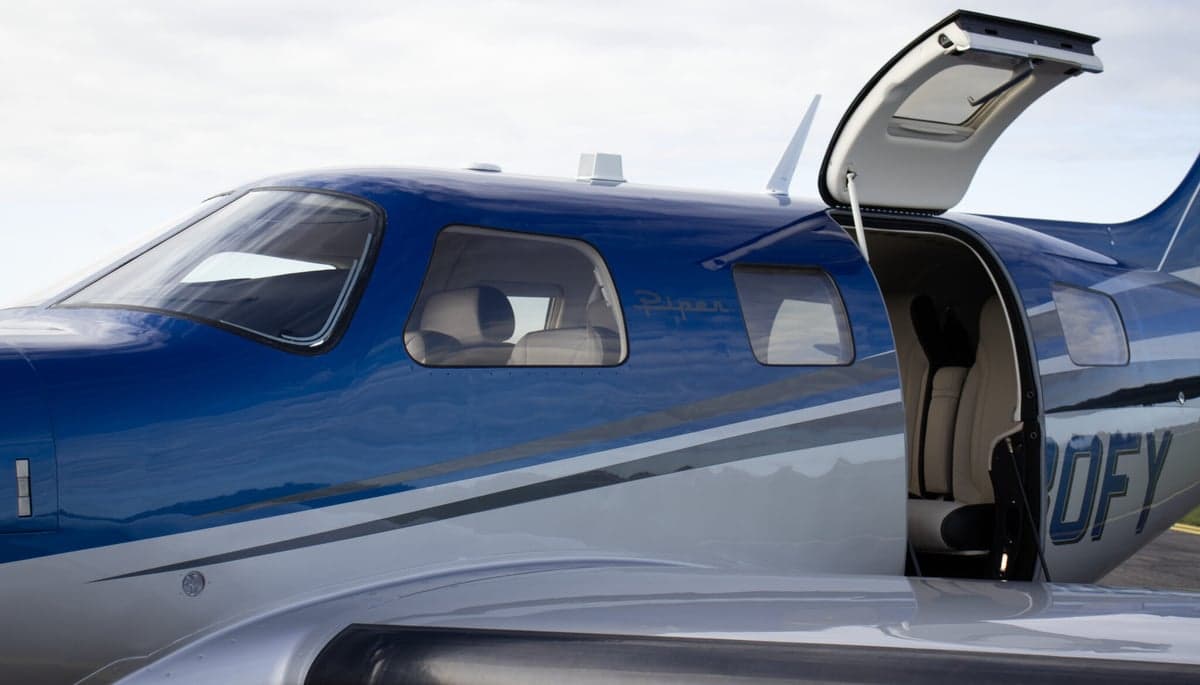 N80FY Piper M600 parked on the tarmac with a blue and silver paint scheme.