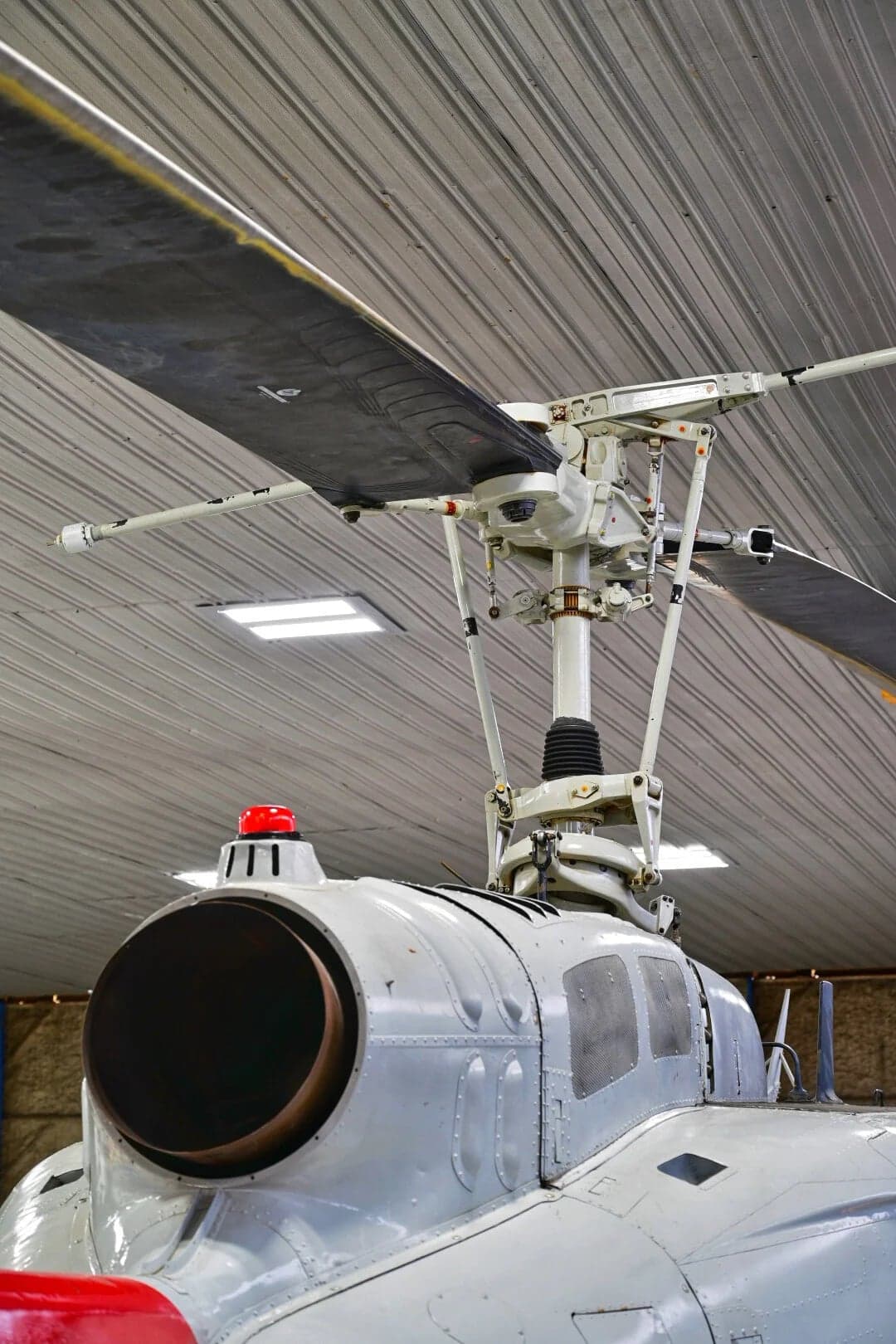 Close-up of the engine exhaust area and rotor assembly of the N857SD helicopter.