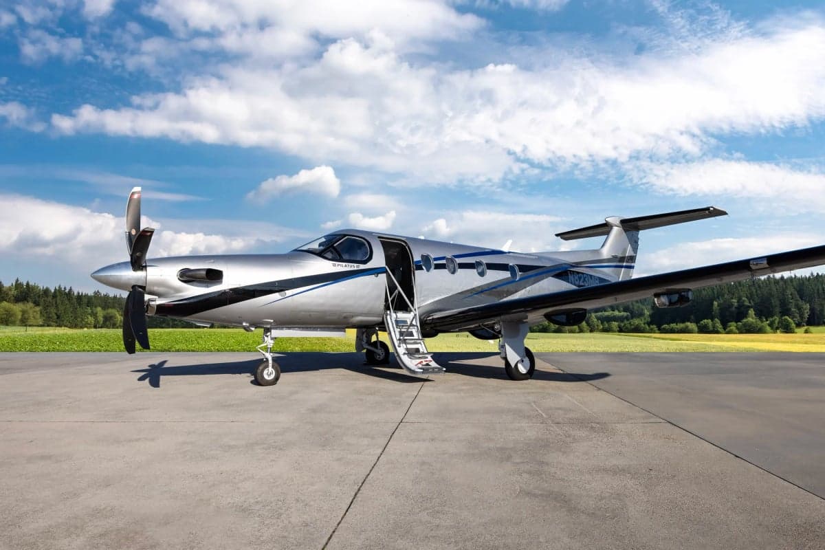 Pilatus PC-12NG with the door and stairs open on the tarmac.