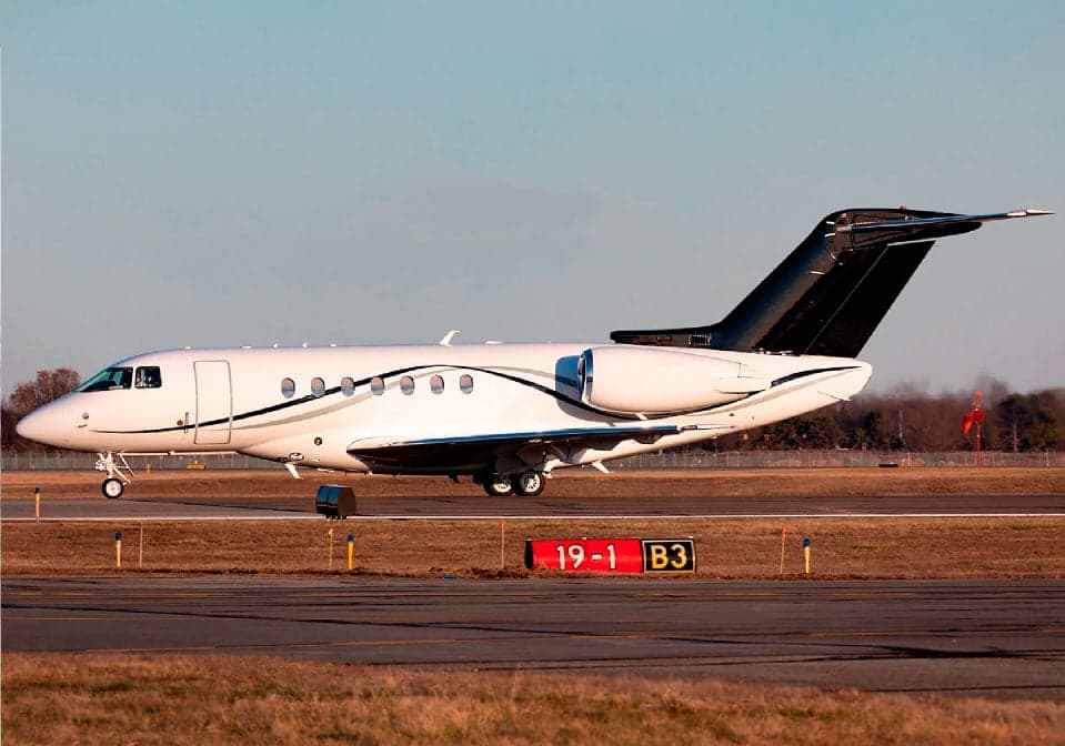A Hawker jet on the runway.