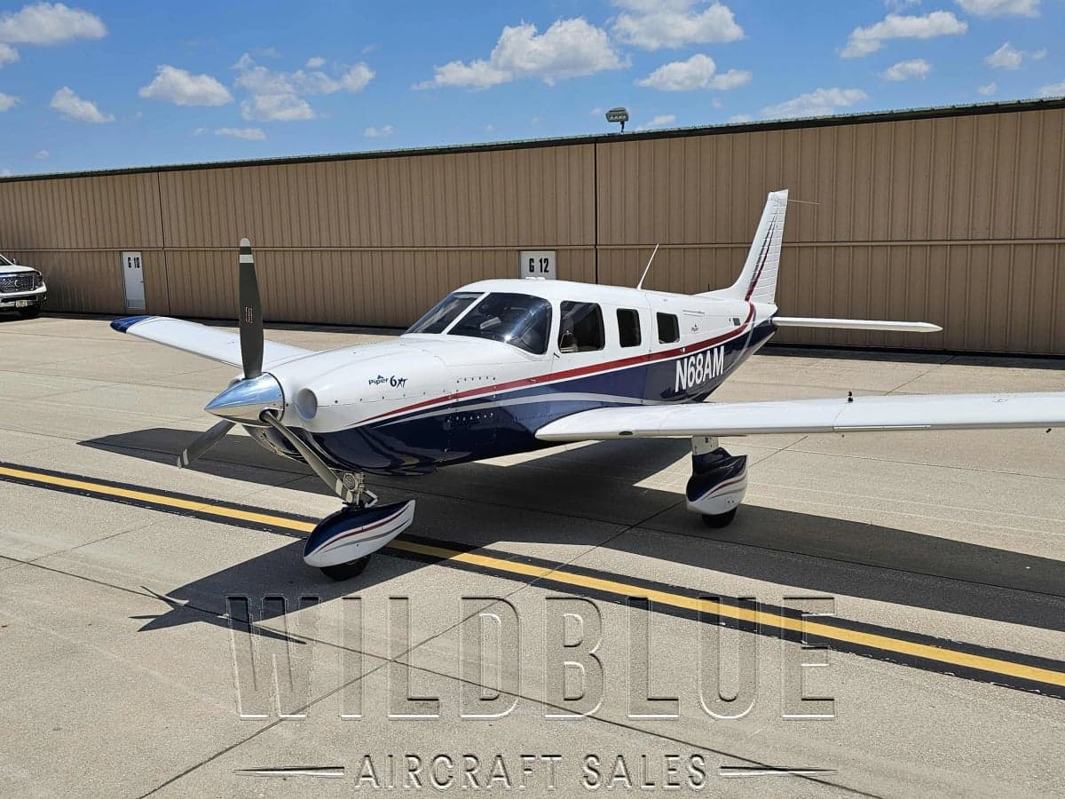 Front view of the Piper PA-28R-201T Turbo Arrow III with Wildblue Aircraft Sales overlay.
