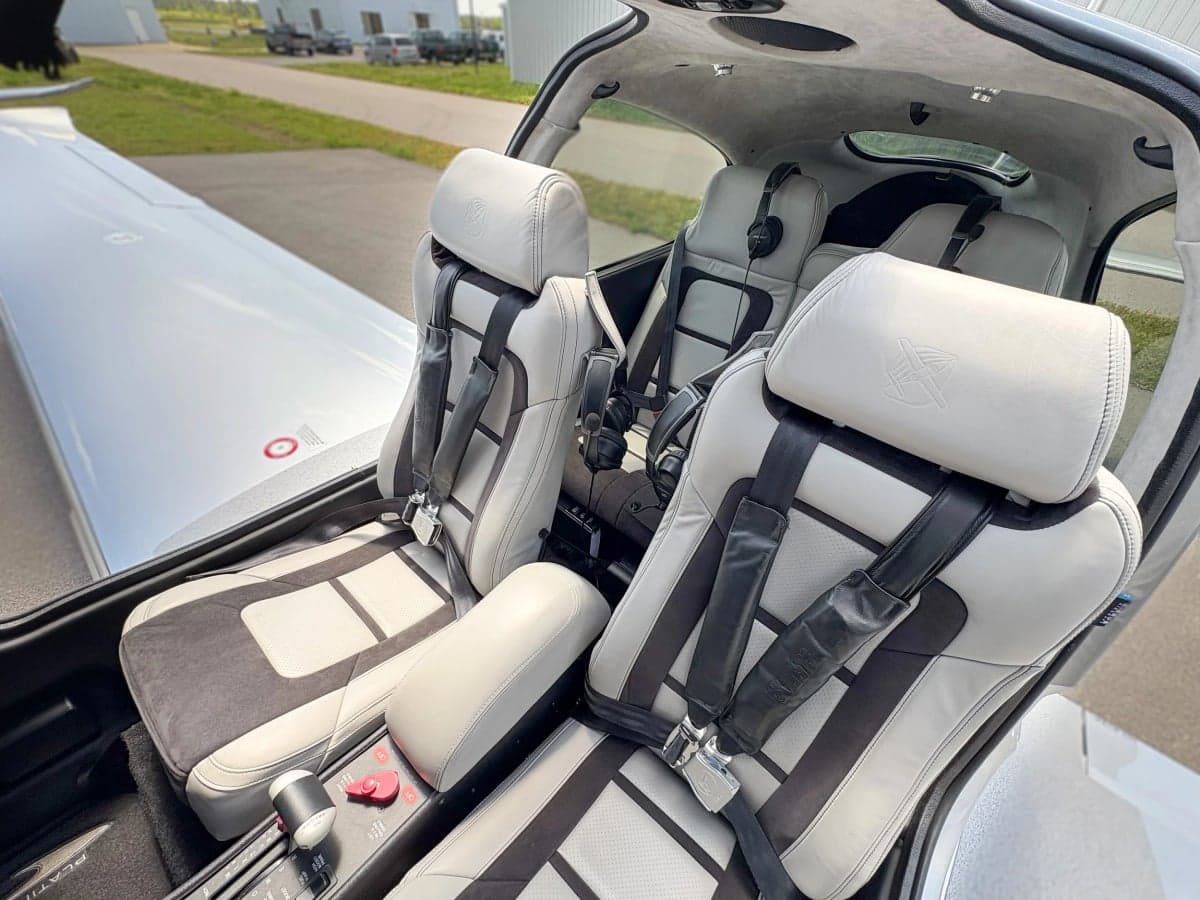 Interior view of the Cirrus SR22T cabin showing the gray leather seats.
