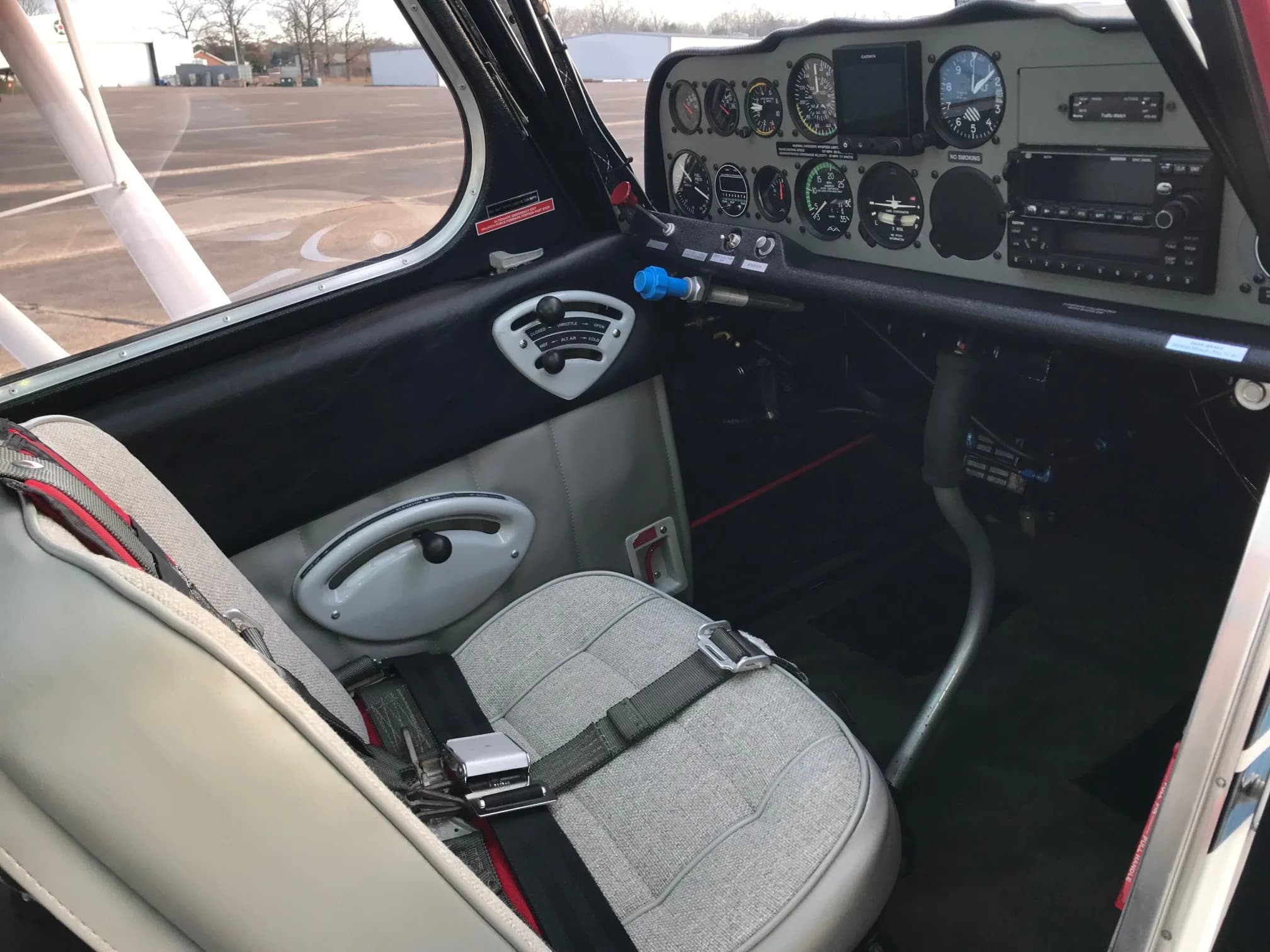 The cockpit interior of the Super Decathlon, showing the pilot's seat and instrument panel.