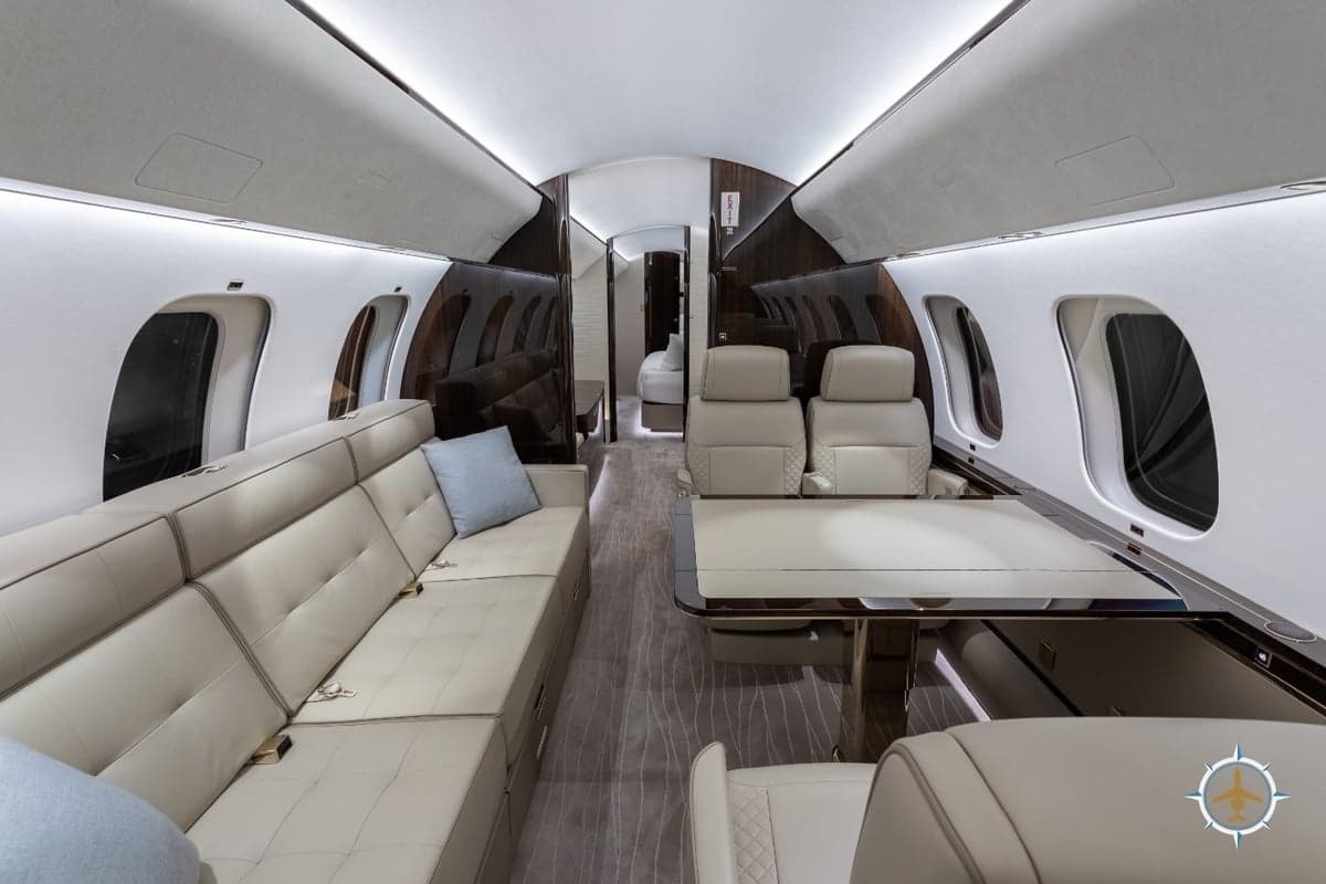 The interior of a Bombardier Global Express aircraft features luxurious seating and amenities.