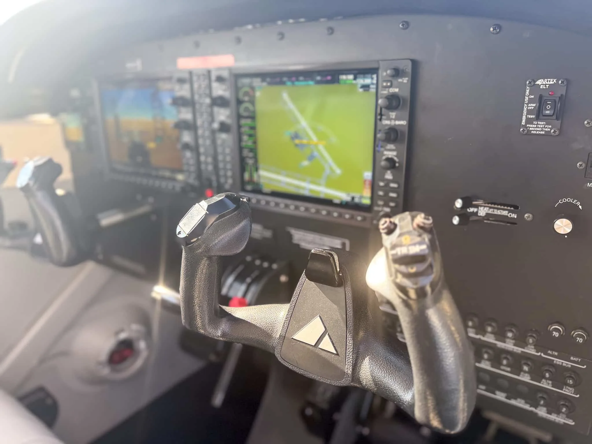 The cockpit of a Piper Archer TX, showing the instrument panel and control yokes from the right seat.