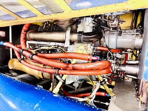 Close-up of the engine compartment of a Bell 407 helicopter.