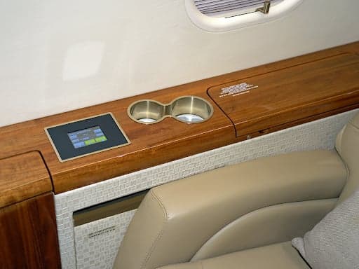 Interior view of the Challenger 300 cabin with leather seats and a couch.
