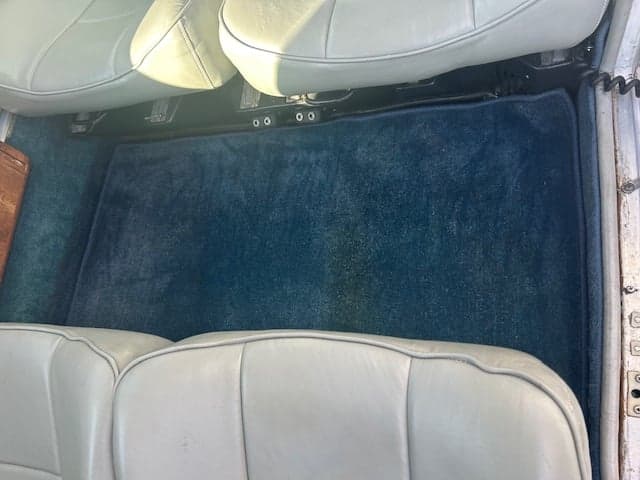 Close-up of the aircraft cabin floor and seats.