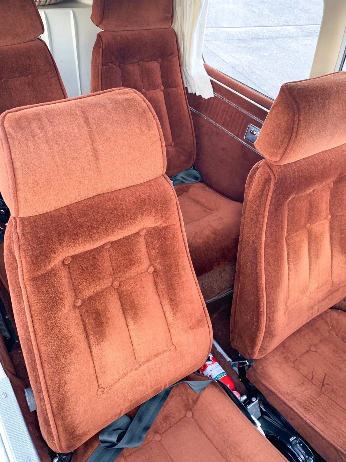 Interior view of the aircraft cabin with brown seats.