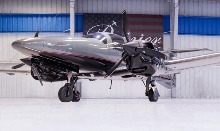 Close-up of a Diamond DA62 aircraft in a hangar.