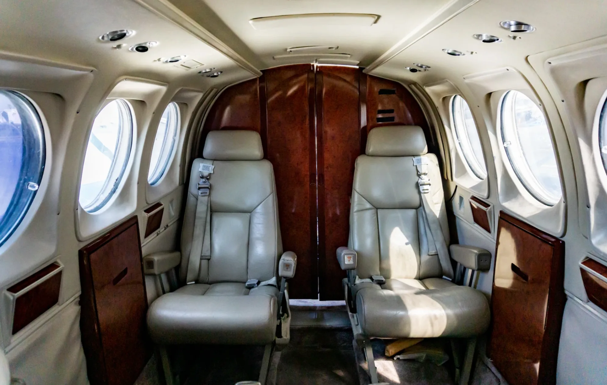 Interior view of the Beechcraft King Air 200 cabin with two seats.