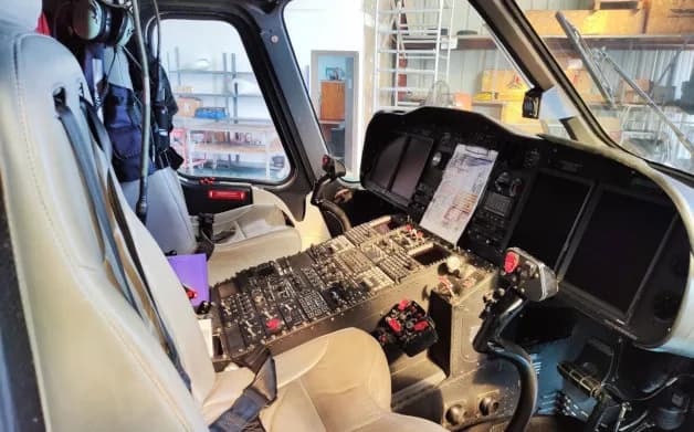 Cockpit view showing the instrument panel of the helicopter.