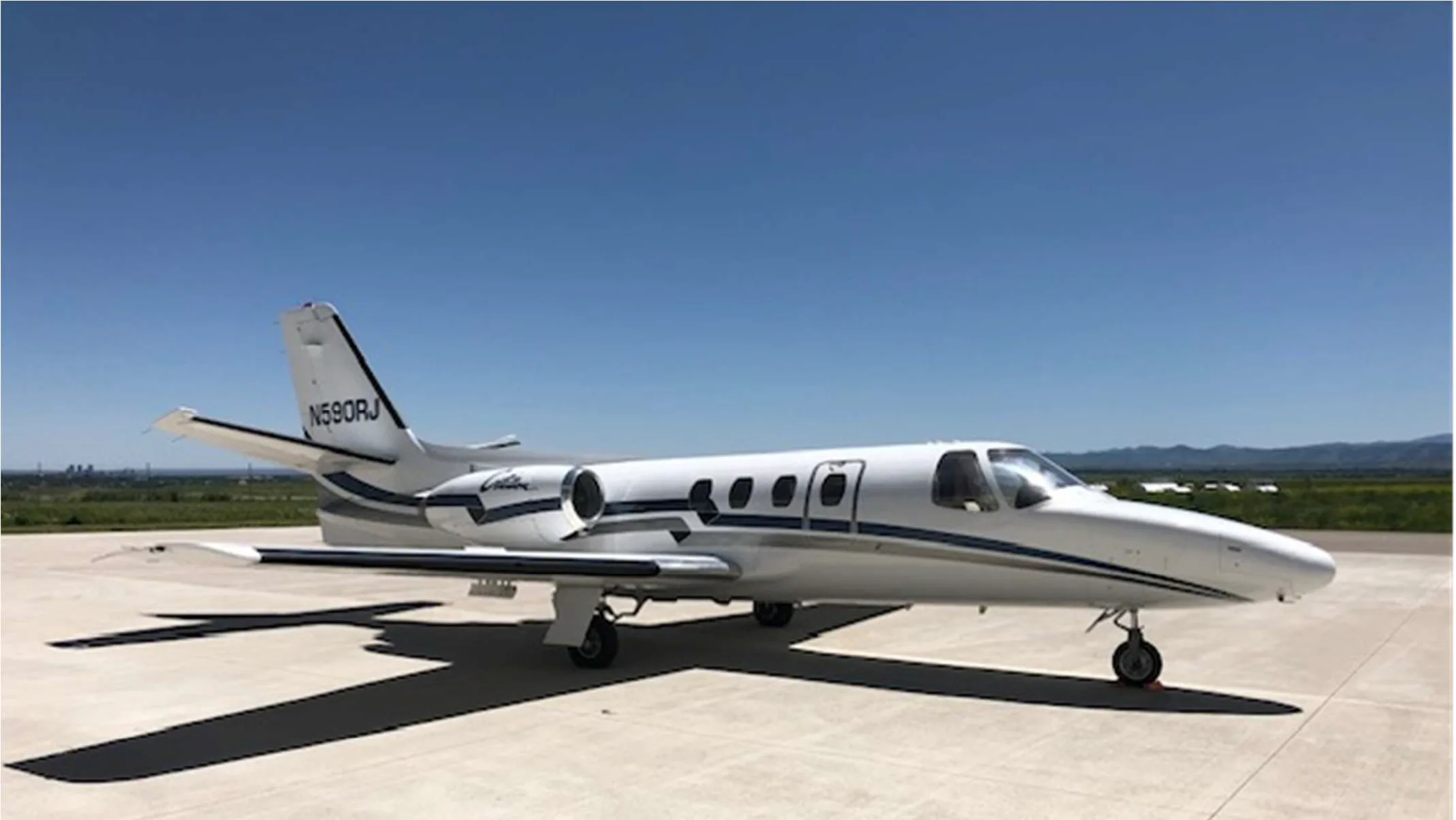 Cessna Citation N590RJ parked on the tarmac.