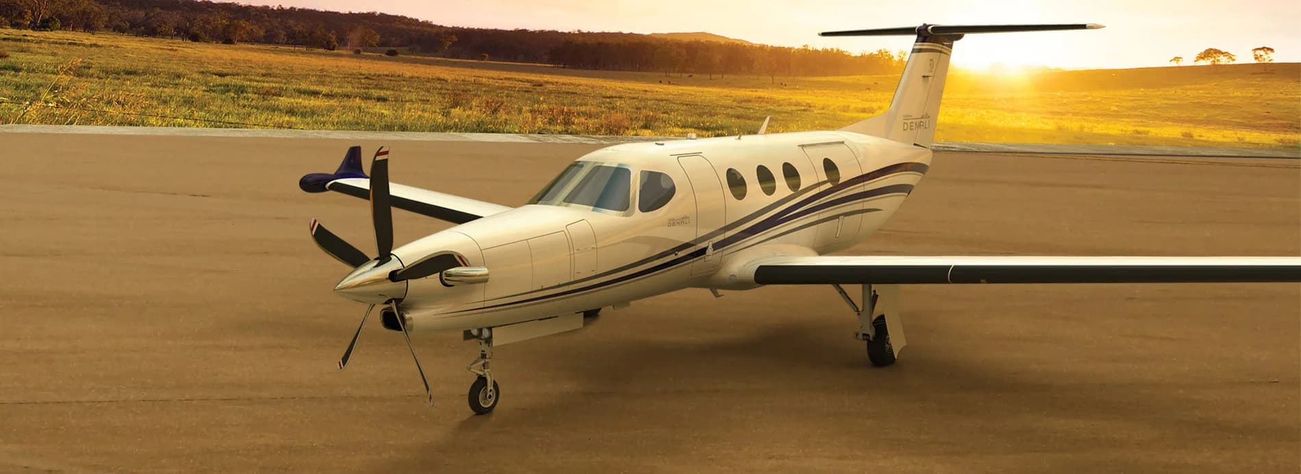 A Pilatus PC-12 on the ground at sunset.