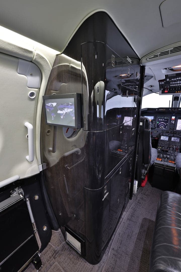 View of the Hawker 400XP cabin showing the entry area and forward seating.