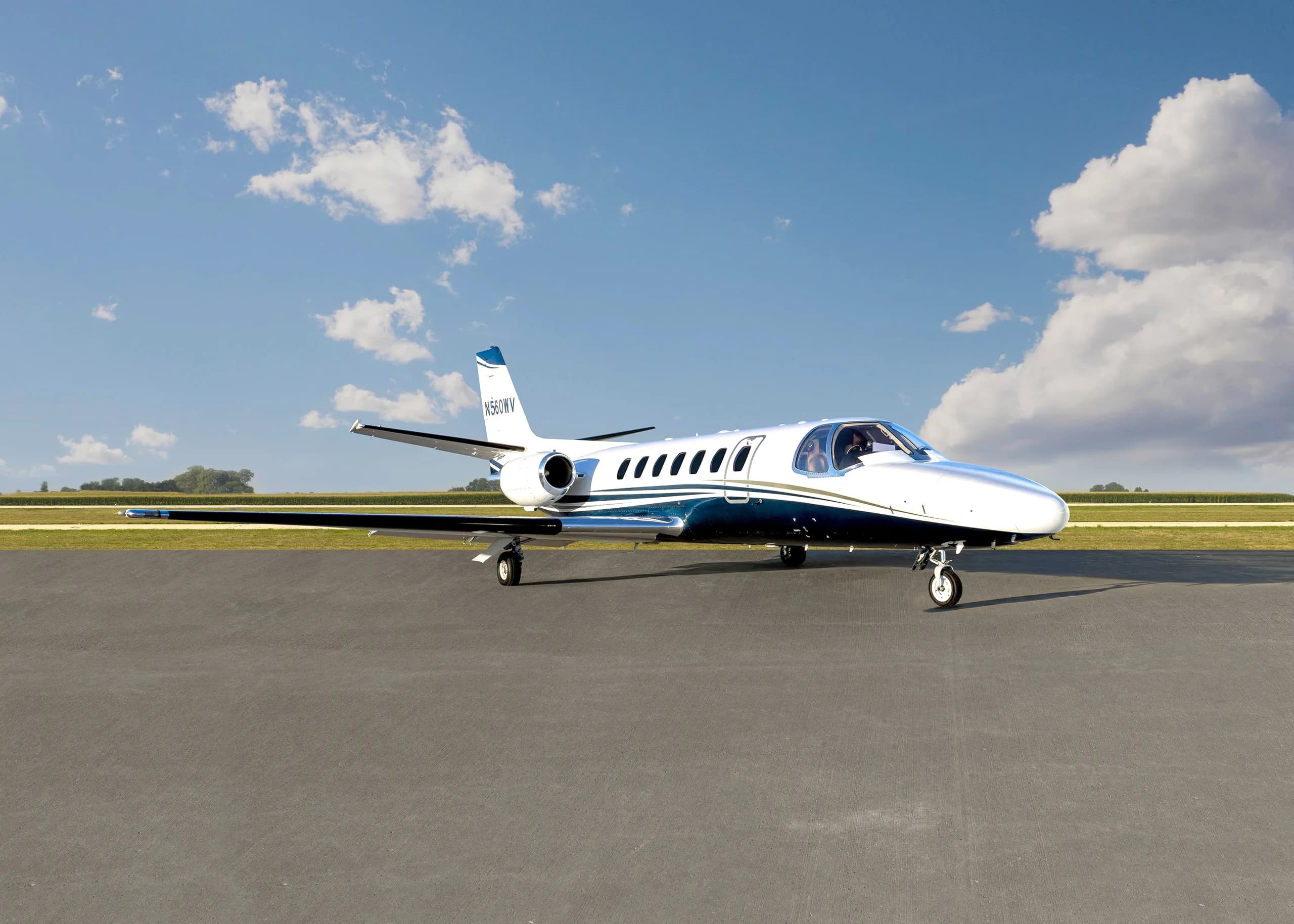 A Cessna Citation CJ1+ aircraft with registration N560WV on the tarmac, front view.