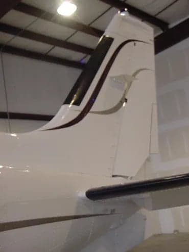 Close-up of the tail of a Cessna 421C Golden Eagle aircraft with registration N2708T.