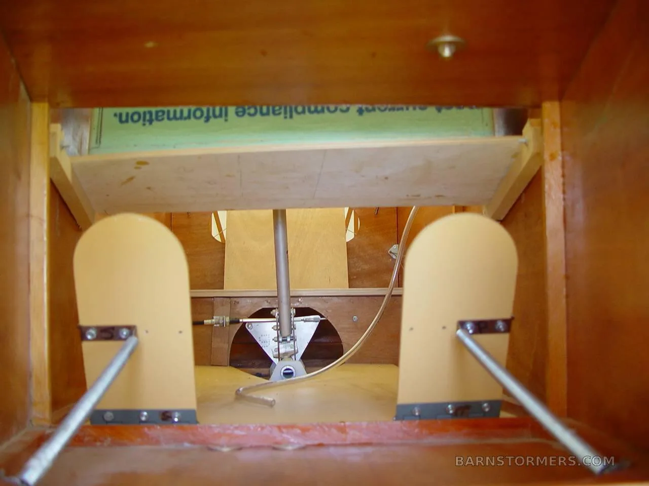 A close-up view of the rudder pedals and floor inside the aircraft's cockpit.