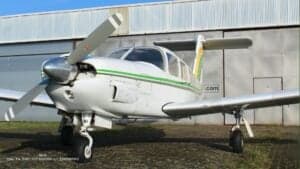 Front view of the Piper Lance II aircraft with white and green paint scheme.