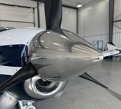 Close up of the propeller spinner on a Beechcraft Bonanza.