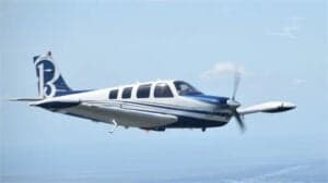 N563AP Bonanza aircraft in flight, side view.