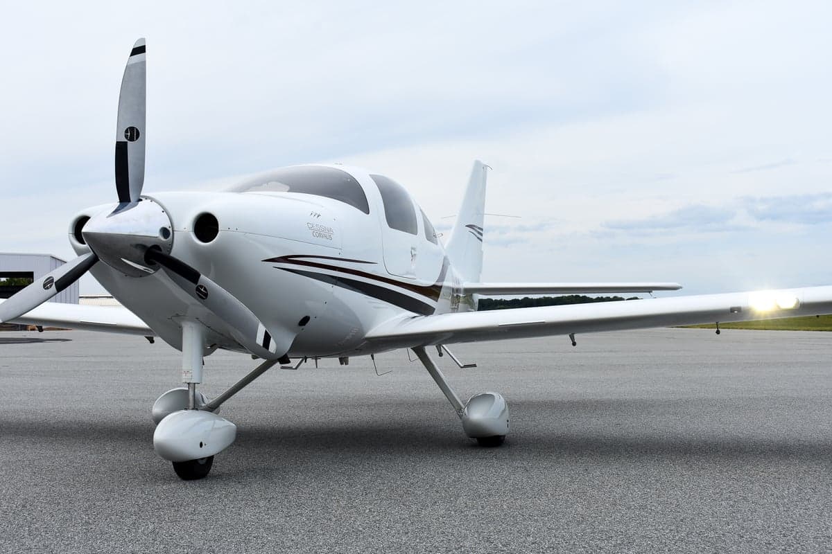 Side view of a white Cessna Corvalis with tail number N1018Q on the tarmac.