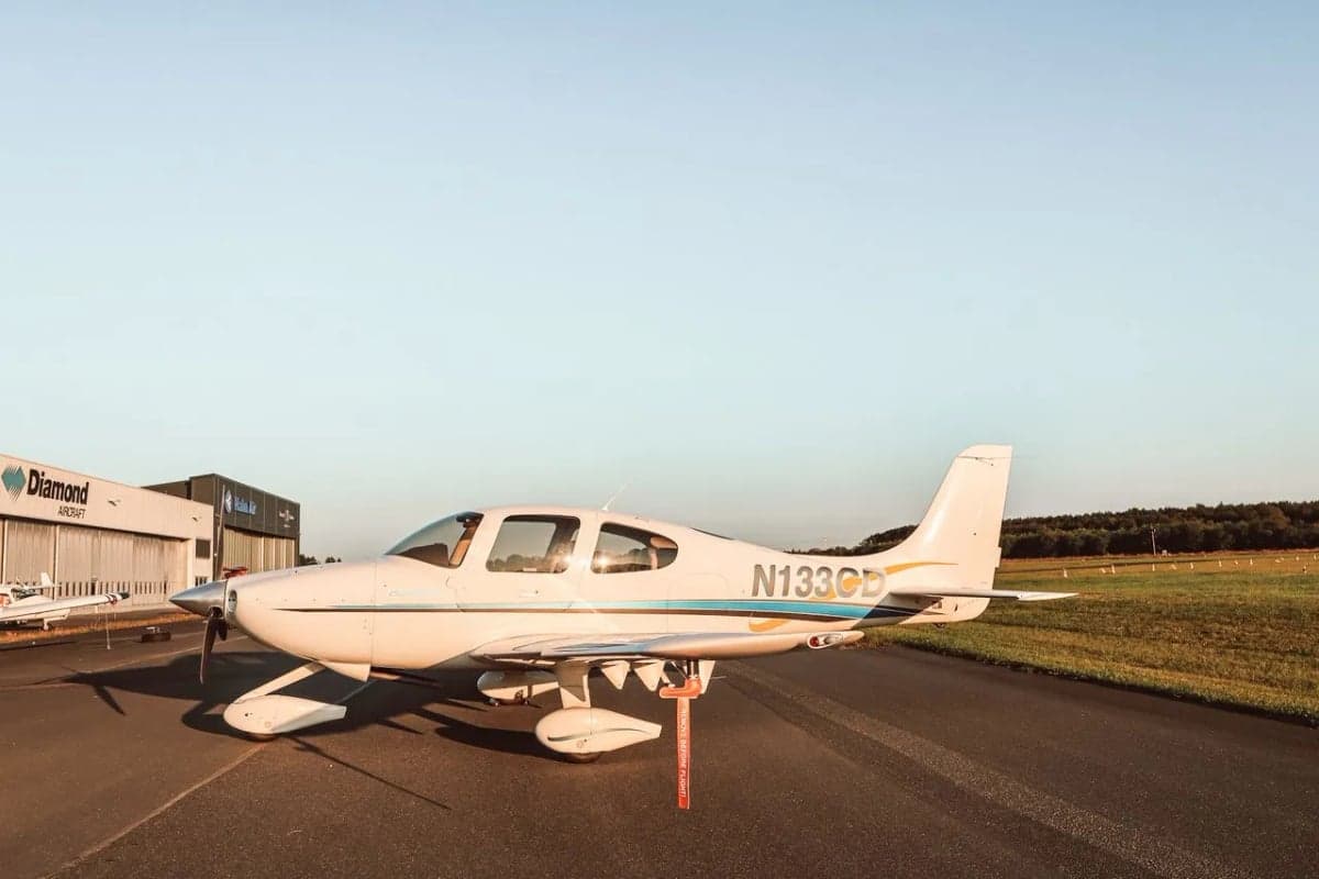 Cirrus SR22 aircraft N133CD parked on the tarmac.
