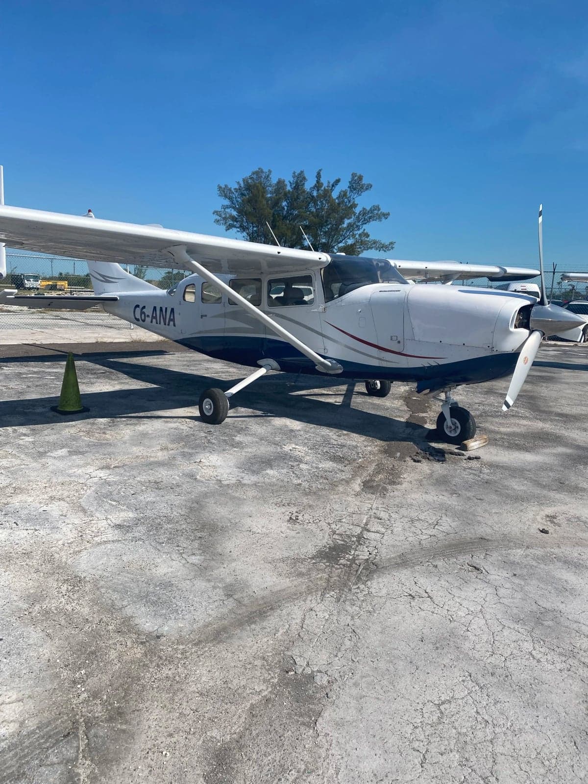 C6-ANA Cessna aircraft parked on the tarmac.